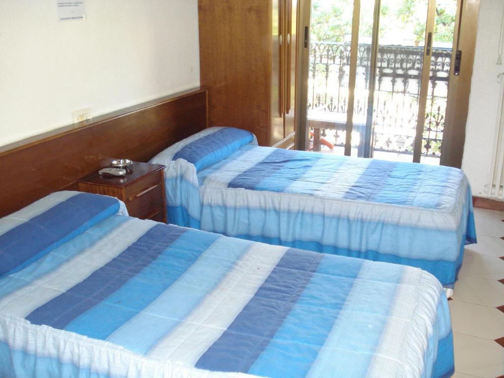 Hostel Central Saragoça Quarto foto