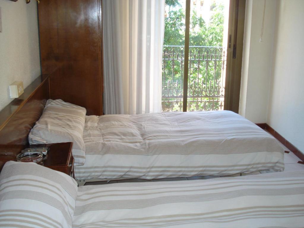 Hostel Central Saragoça Quarto foto